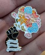 Product Description: "Give Us Our Flowers While We Are Still Here" is the theme of our2021 Trasnsgender Day of Visibility social mediacampaign.</br></br>And now you can have this pin to remind you of the trans joy we all deserve every day!</br> 2021 TDOV Pin